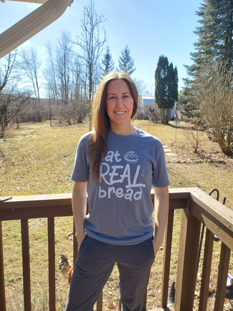 Person on deck wearing "Eat Real Bread" shirt.