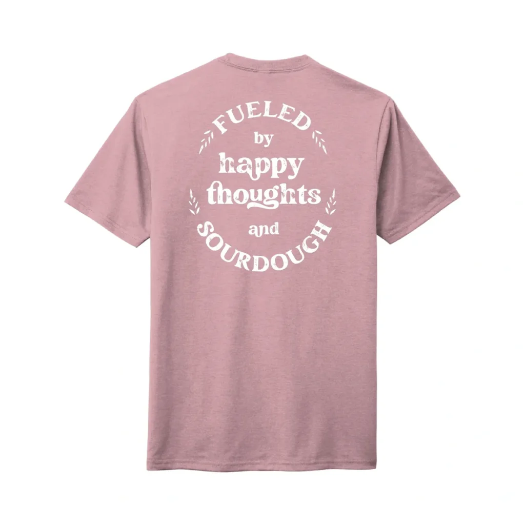 Pink T-shirt with motivational text print.