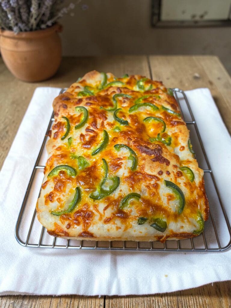 Freshly baked sourdough focaccia with cheese and jalapeños