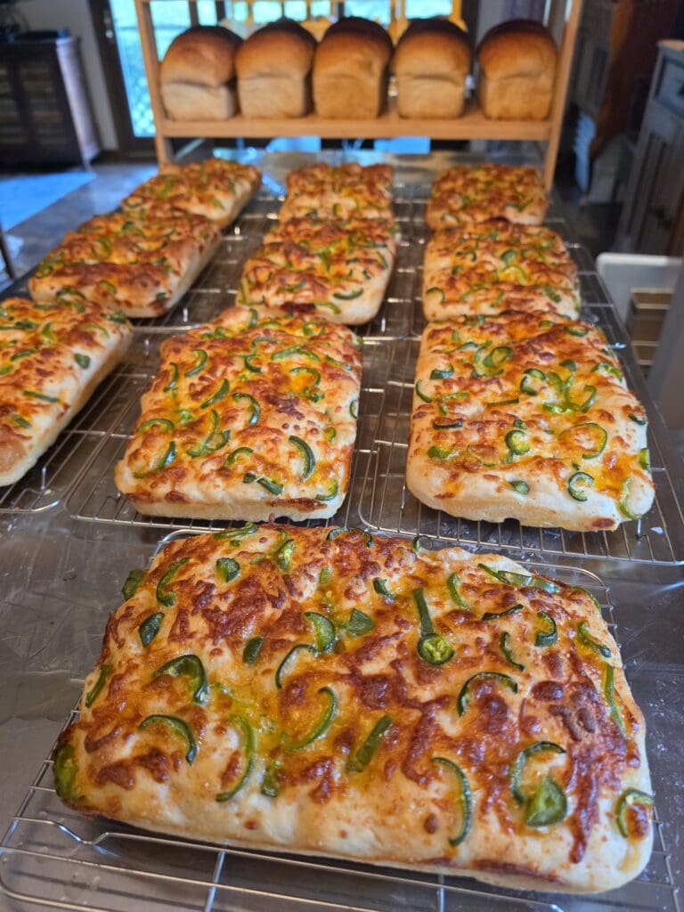 Freshly baked sourdough focaccia with cheese and jalapeños